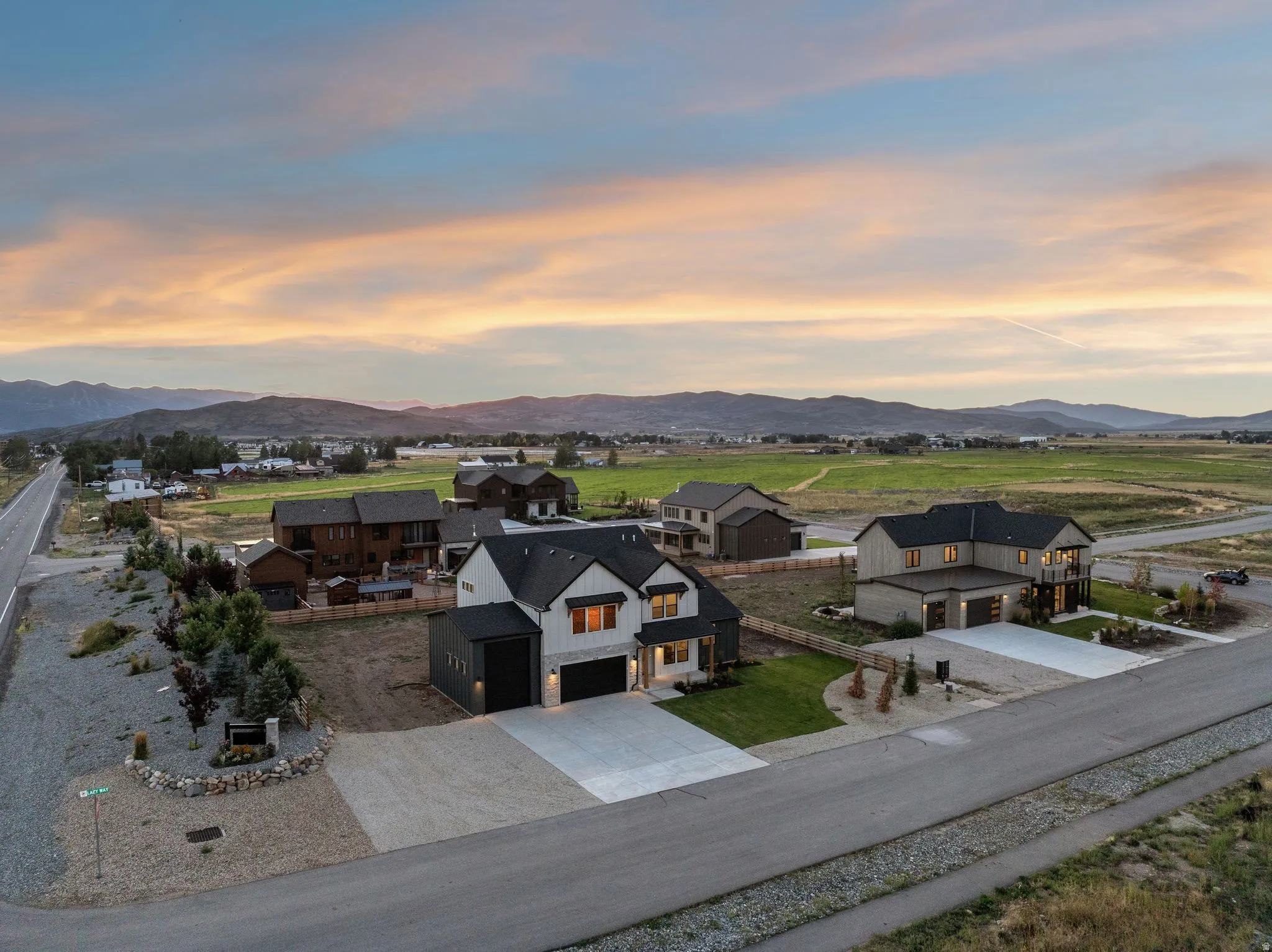 Expansive rural setting with mountain backdrop