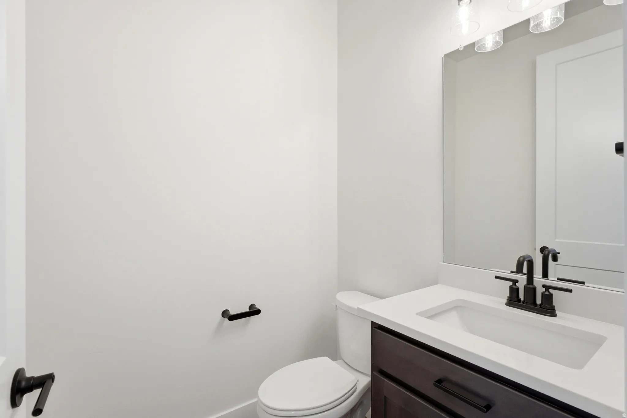 Powder room off front door.