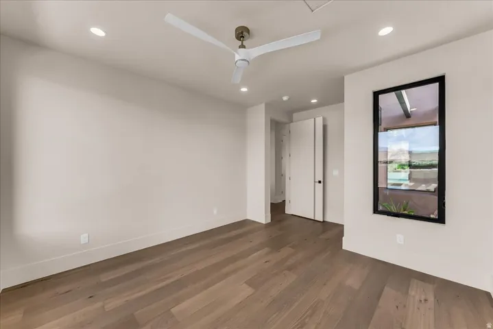 Wood-finish flooring, recessed lighting, and a modern ceiling fan