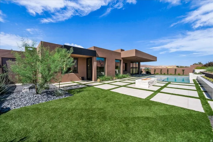 Desert modern exterior with a flat roofline and stucco finish