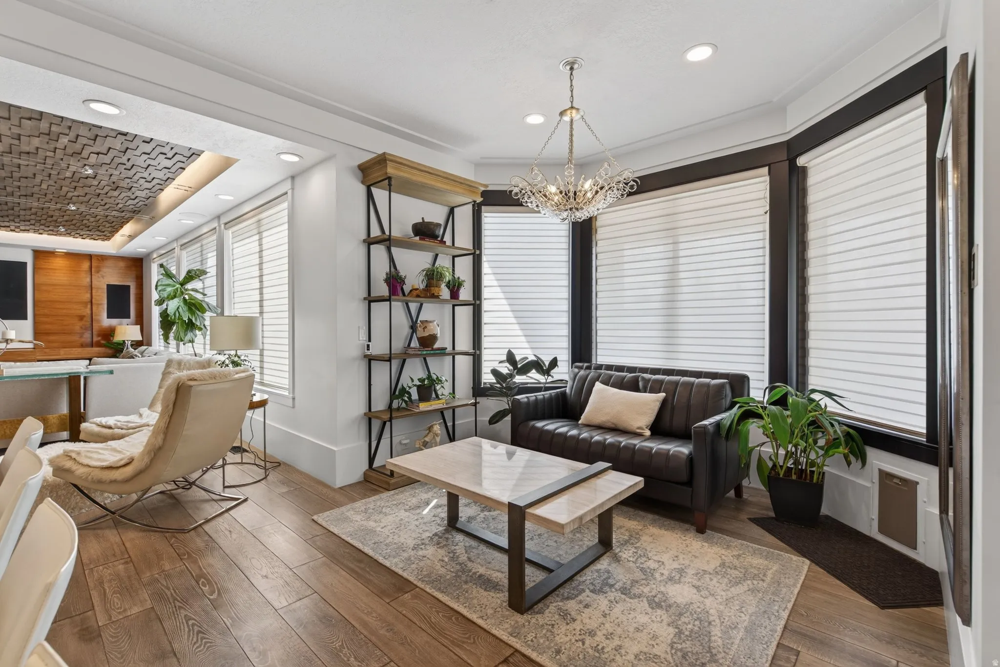 Bay window with dark trim, recessed lighting, wood-finish flooring, and a decorative ceiling panel
