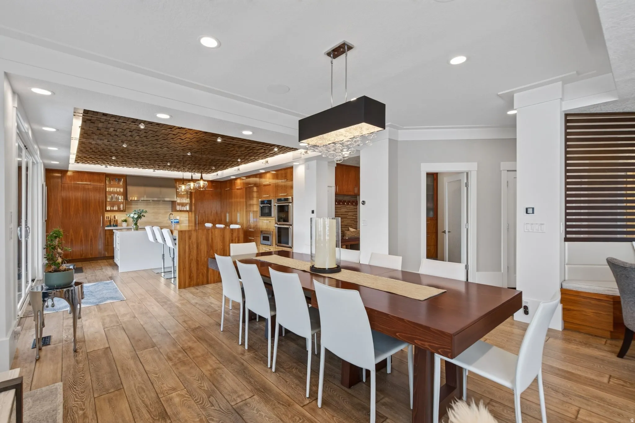 Wood-finish flooring throughout, with a recessed lighting array