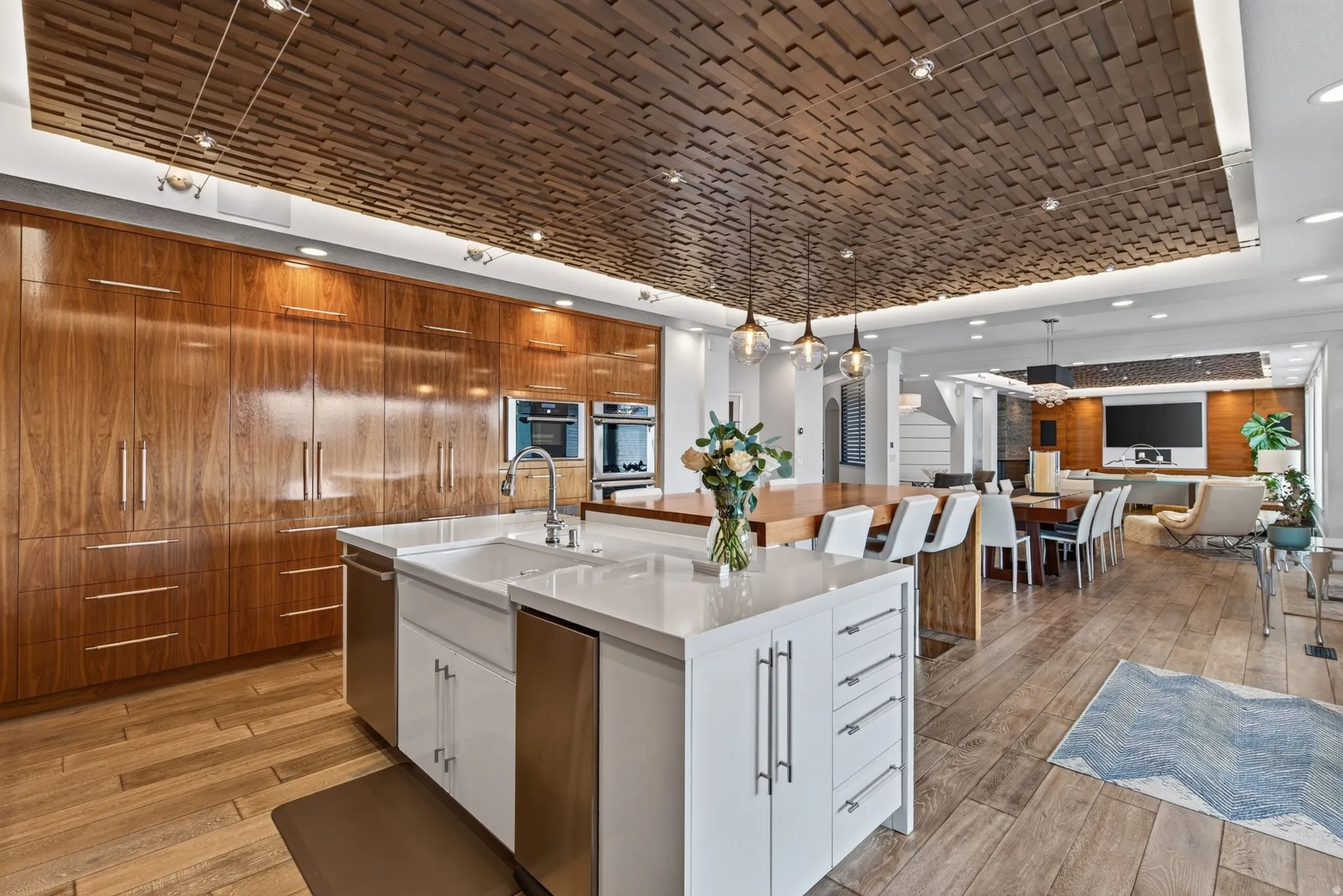 Wood-finish tile flooring throughout, featuring a custom wood-panel ceiling