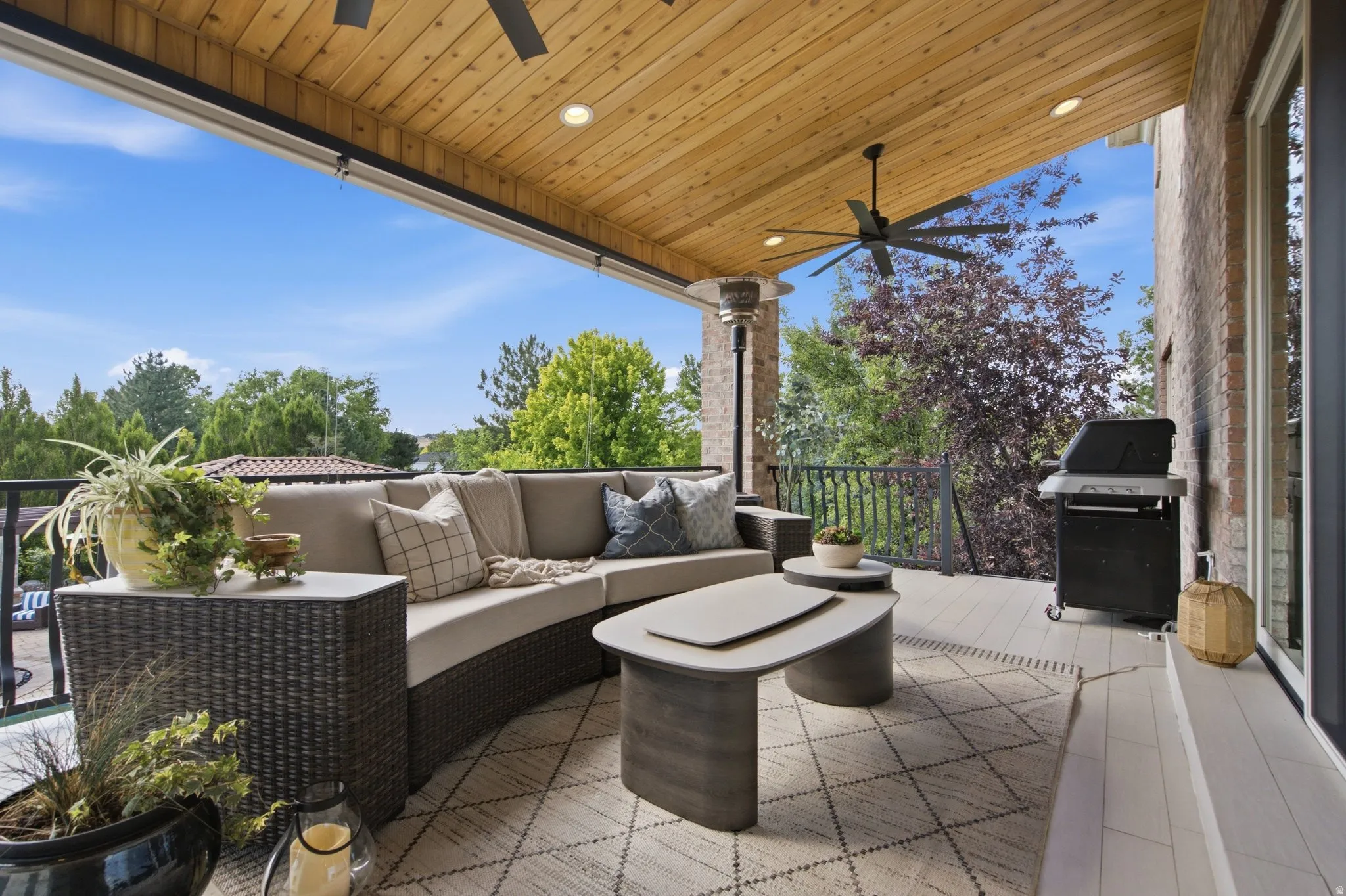 Covered patio with a wood-finish ceiling, recessed lighting, and a ceiling fan