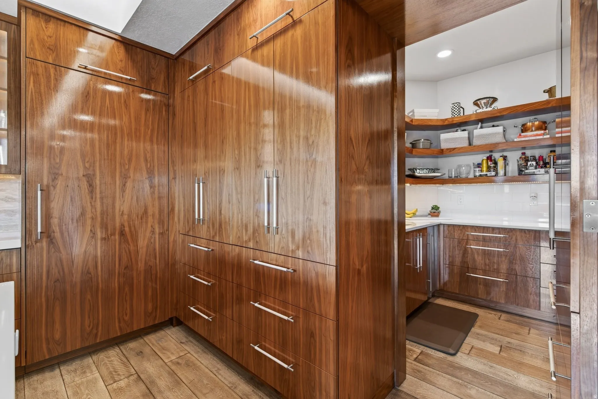 Rich wood-finish cabinetry with polished chrome hardware