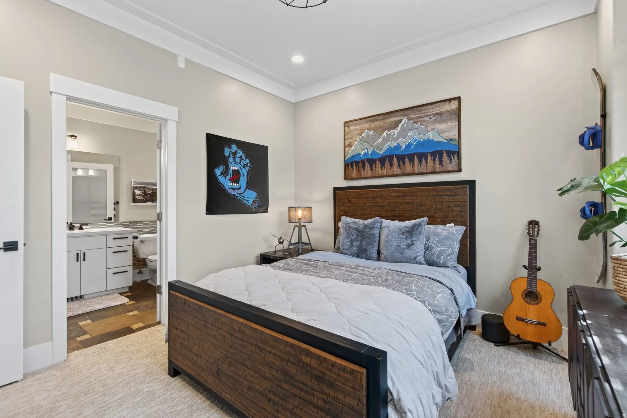 Wood-finish bed frame with a textured headboard, light-toned wall paint, and white crown molding