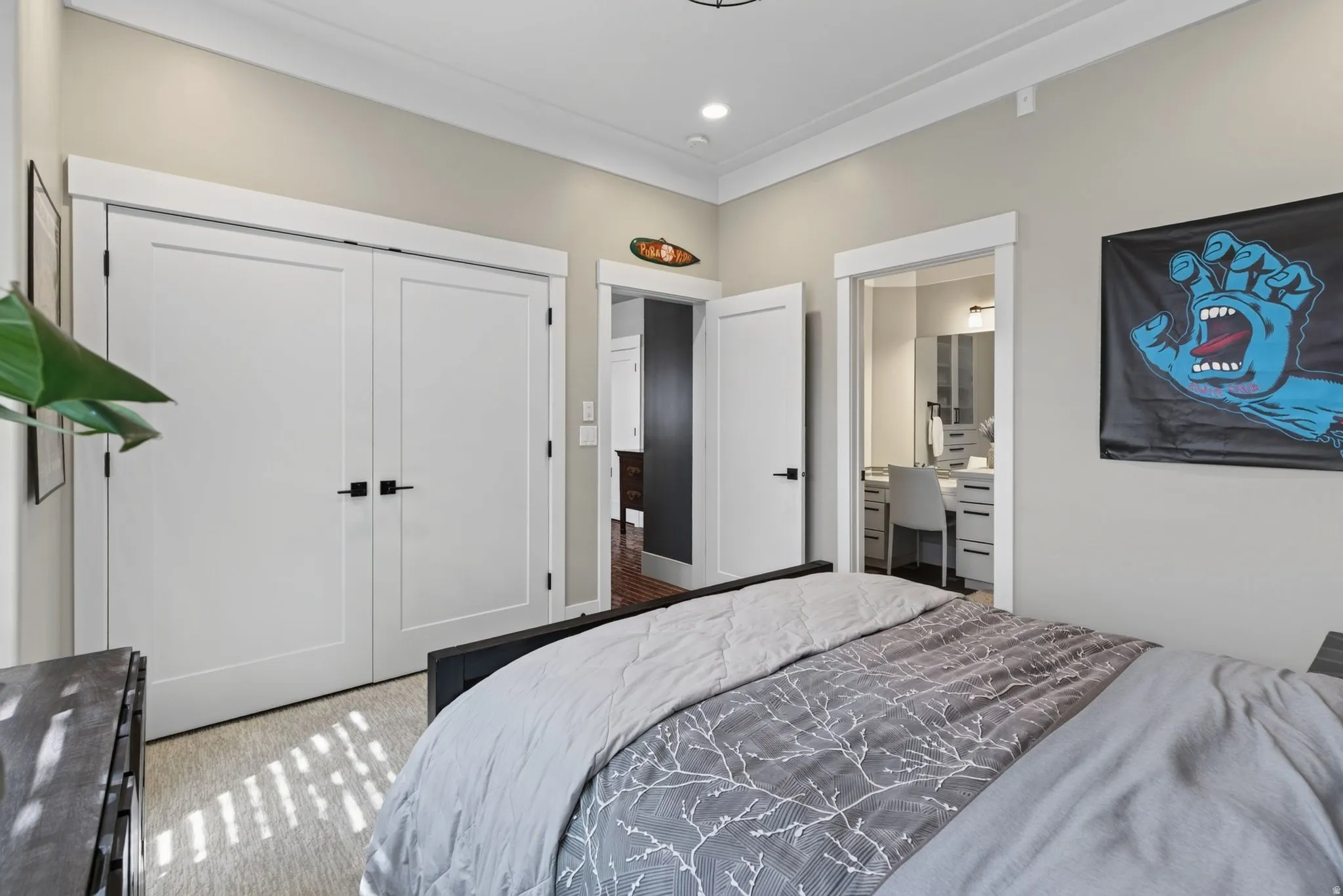 Recessed lighting, crown molding, and light gray wall paint