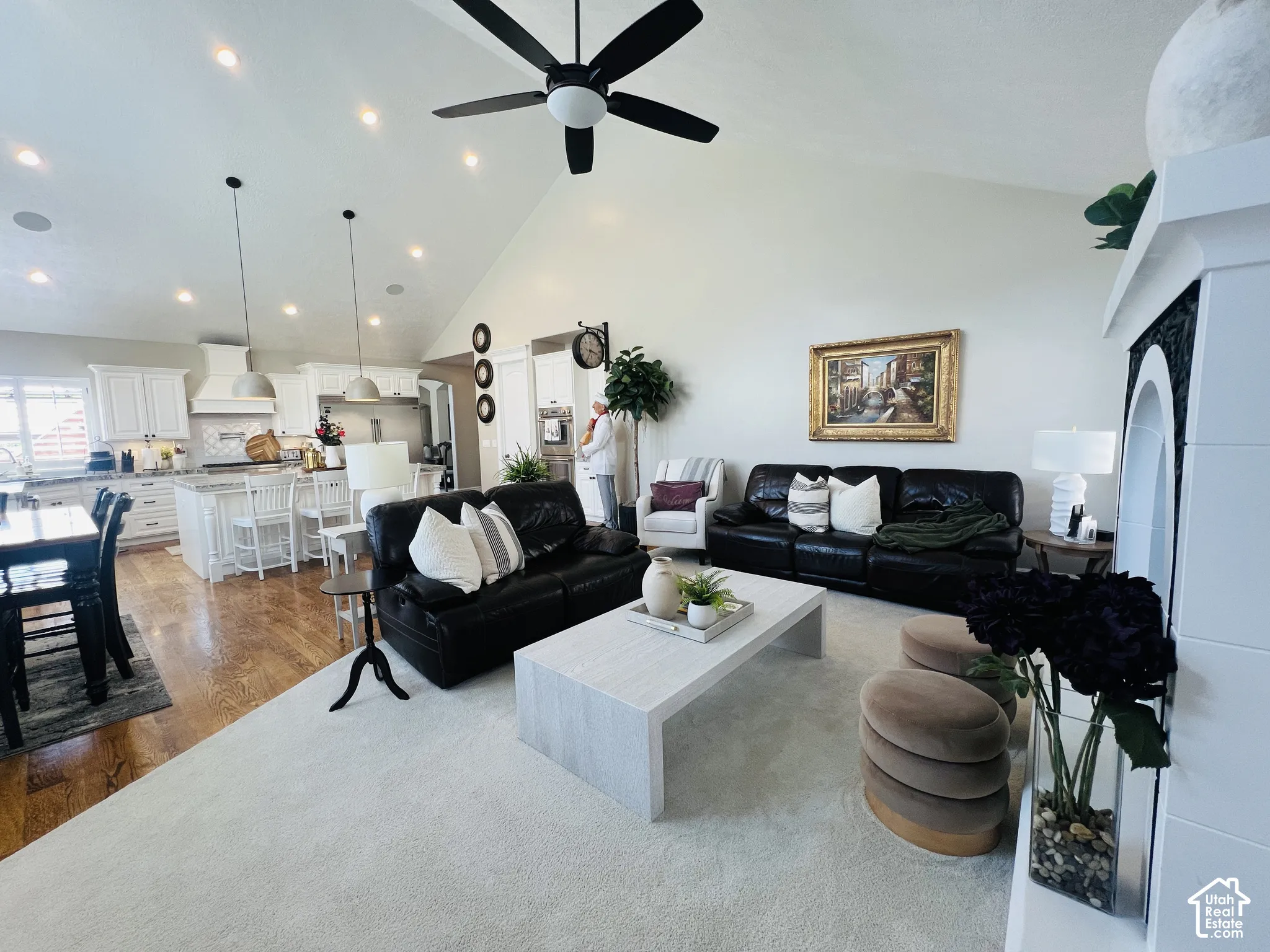 Vaulted ceiling featuring recessed lighting and a ceiling fan