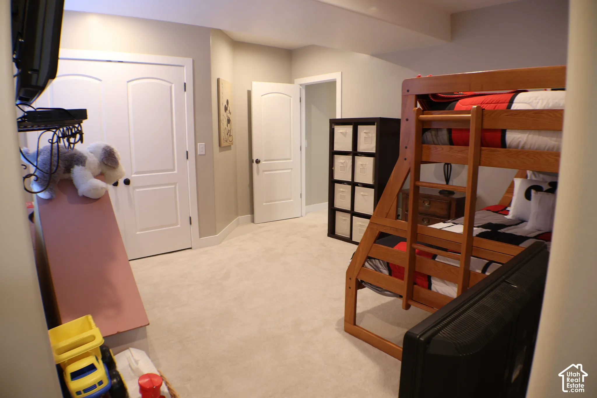 Neutral wall color, carpeted flooring, white interior doors, and recessed lighting
