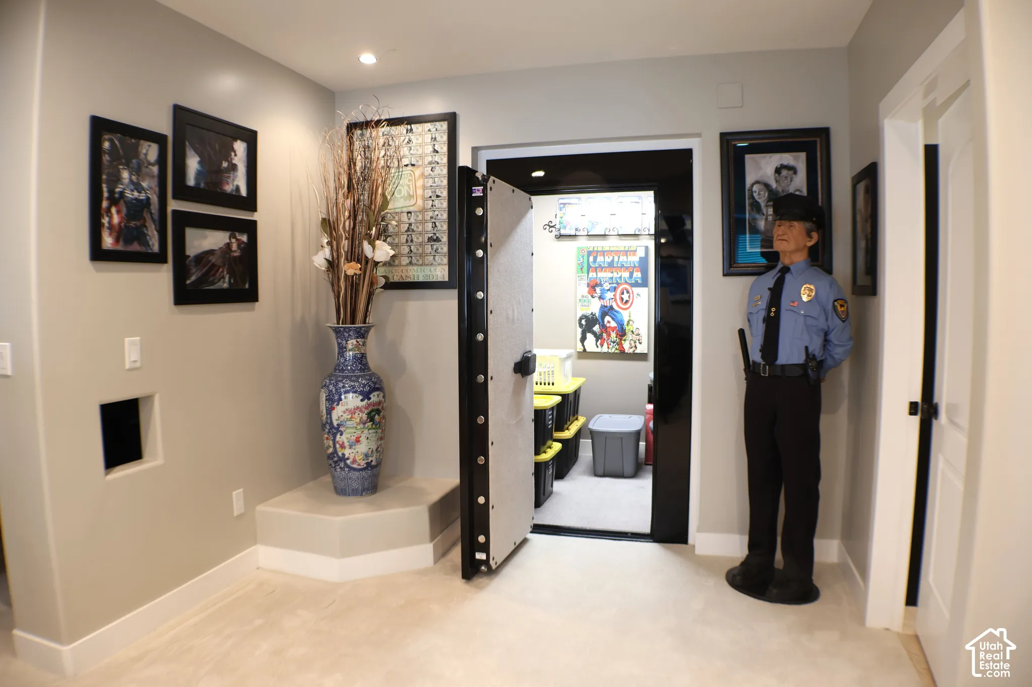 Secure entry with a heavy-gauge door, recessed lighting, and soft carpeting