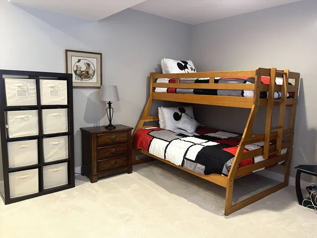 Wall-to-wall carpeting with light gray wall paint