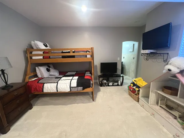 Neutral gray wall paint and light-toned carpeting