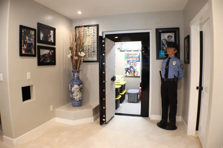 Secure entry with a heavy-gauge door, recessed lighting, and soft carpeting