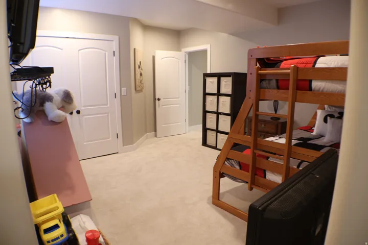 Neutral wall color, carpeted flooring, white interior doors, and recessed lighting
