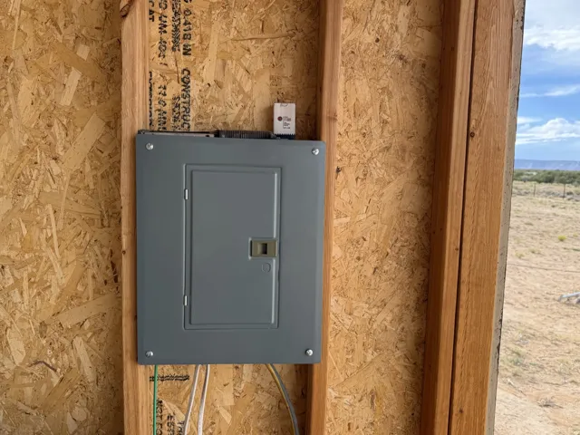 Electrical service panel mounted on oriented strand board sheathing