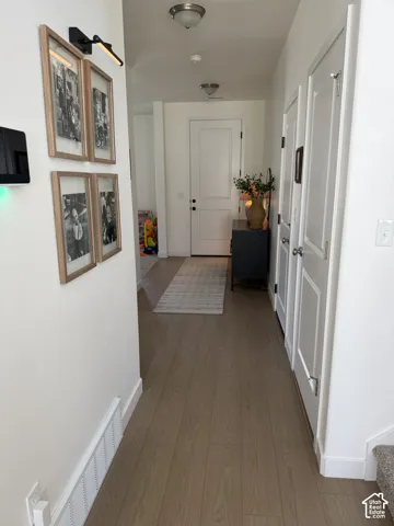 Wood-finish flooring extending through the hallway