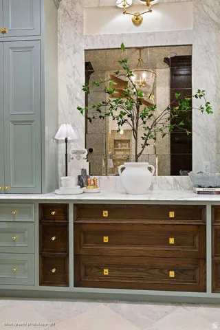 Built-in cabinetry in a two-tone finish, featuring light wood-finish and dark wood-finish drawers