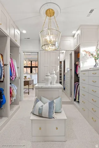 Custom built-in cabinetry with gold-finish hardware