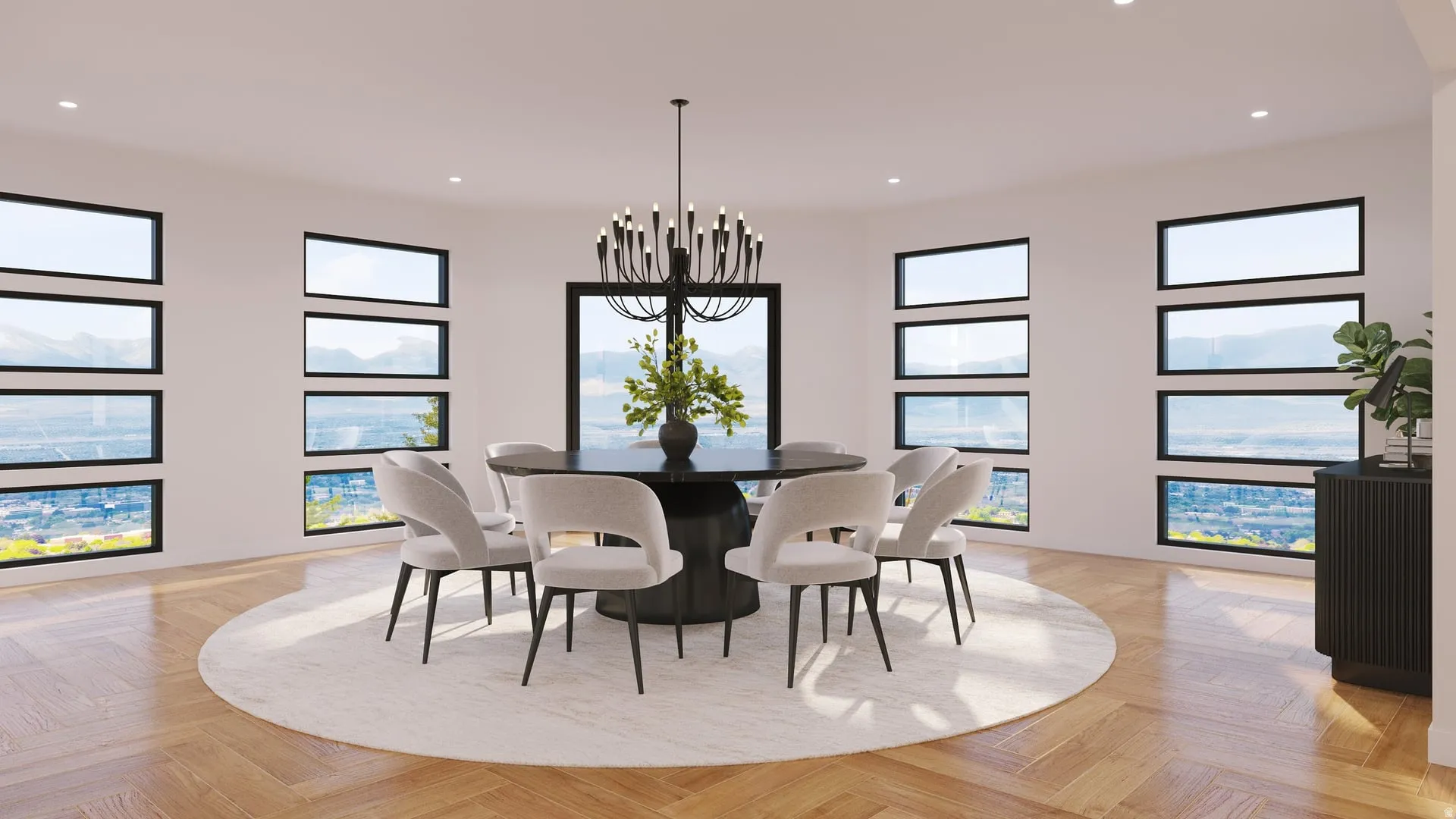 Herringbone wood-finish flooring, recessed lighting, and a prominent chandelier