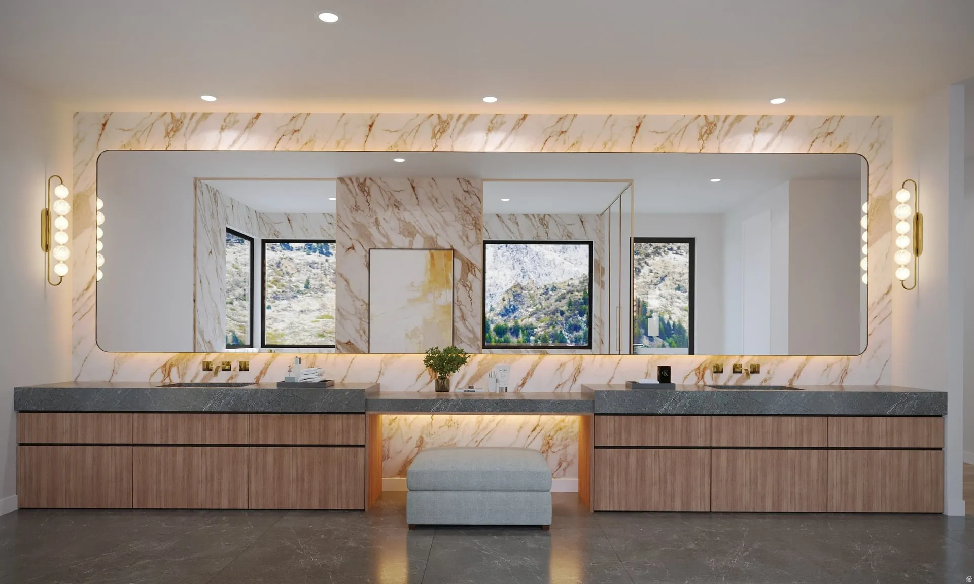Dual wood-finish vanities with gray stone countertops and integrated sinks