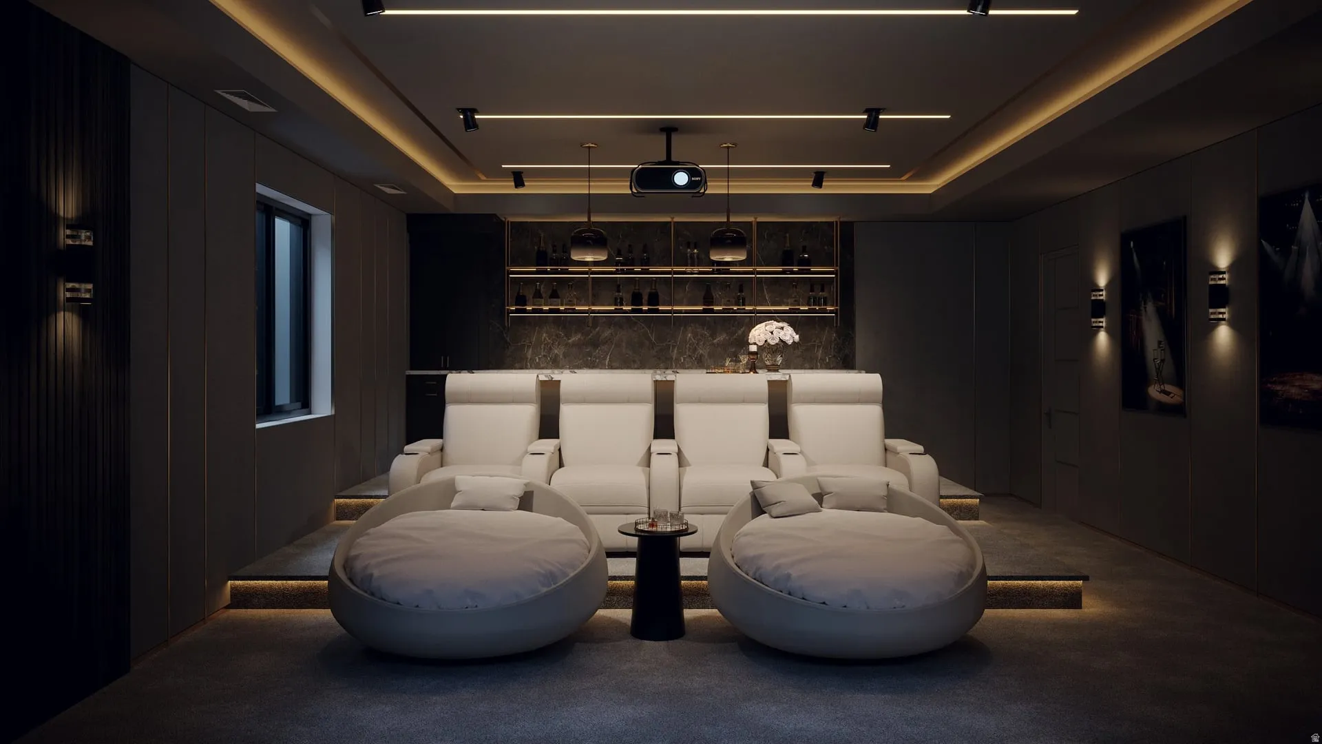 Dedicated media room featuring tiered seating, built-in shelving with integrated lighting, and a recessed ceiling with track lighting