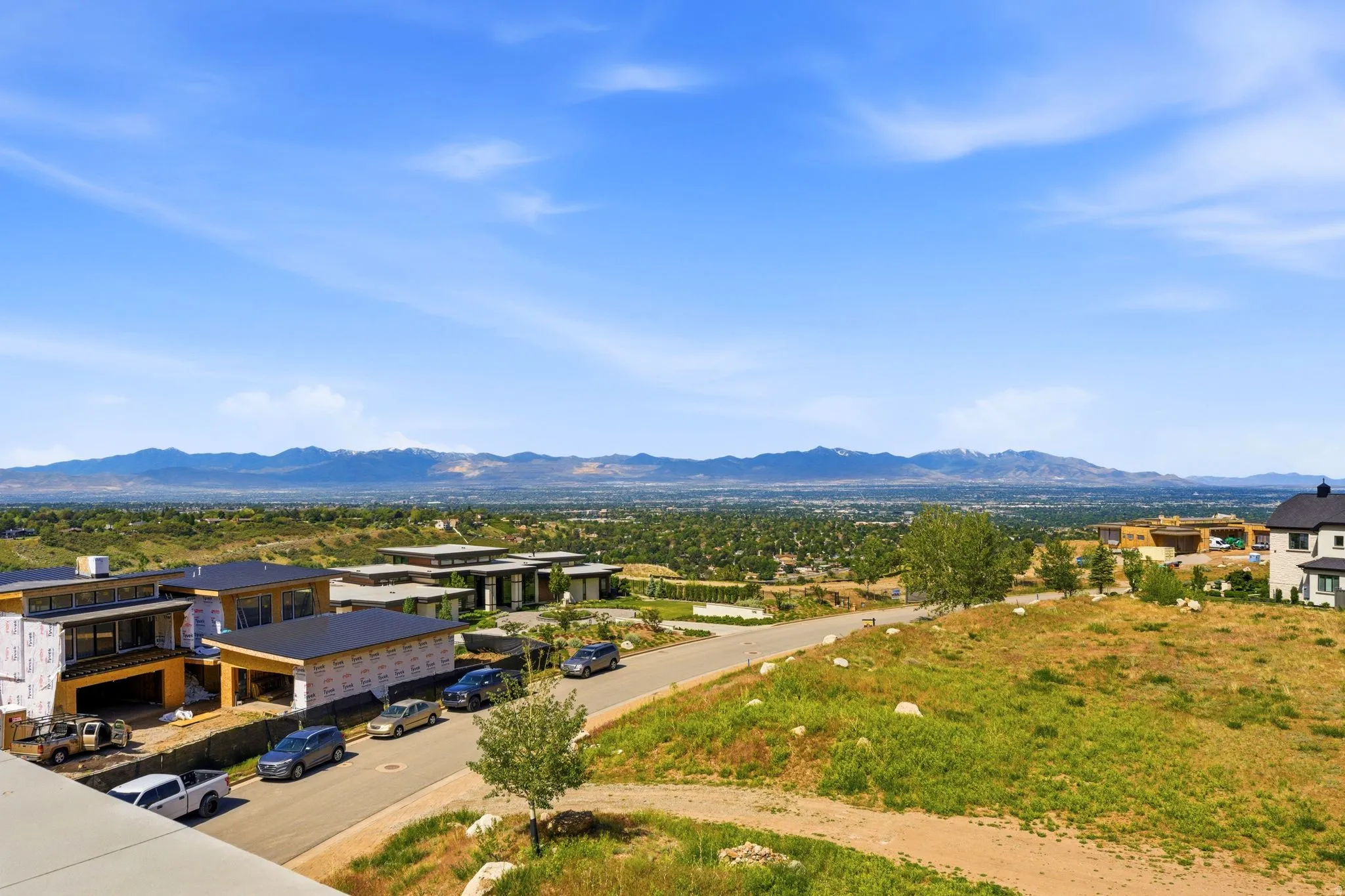 Expansive mountain range scenery with surrounding residential development