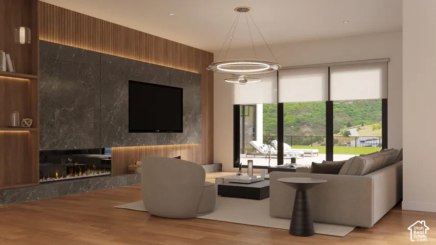 Wood-finish flooring, accent wall with vertical wood paneling, integrated wall shelving, large format stone-finish tile, and a built-in linear fireplace