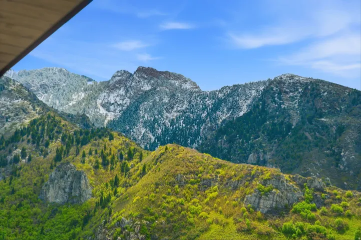 Mountain range with a blue sky background
