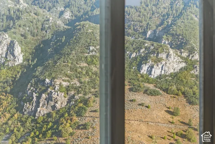 Panoramic mountain landscape visible through a window frame