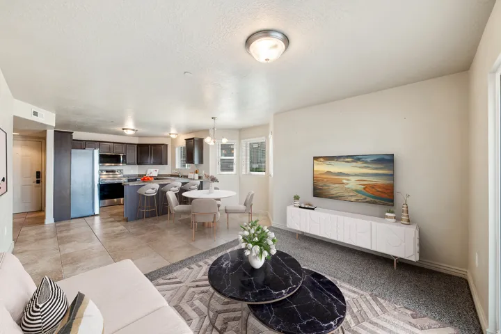 Kitchen featuring dark wood-finish cabinetry, stainless steel appliances, and a breakfast bar. *Virtually staged photo.