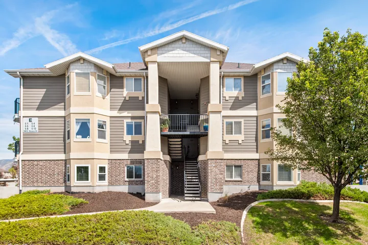 Exterior of condo building. Condo is located on main level.