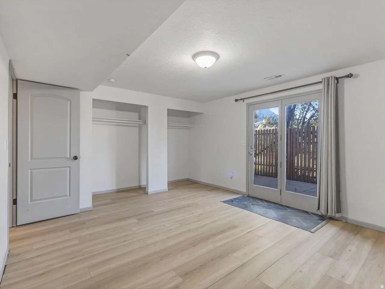Wood-finish flooring with dual built-in closets