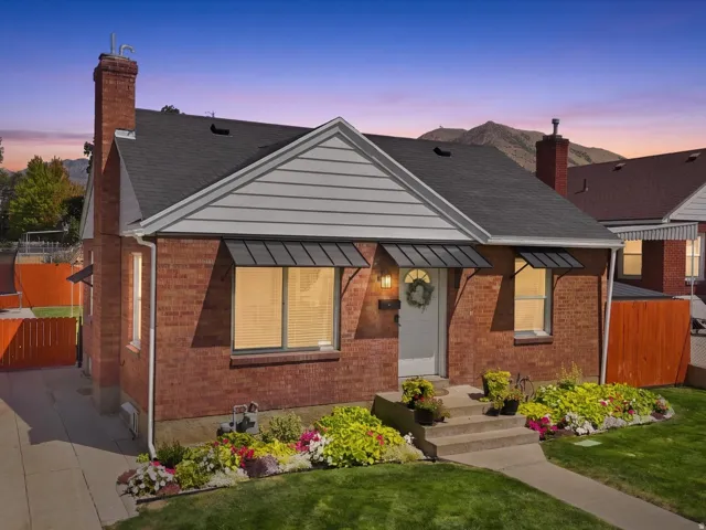Brick exterior with a gabled roof and front awning windows
