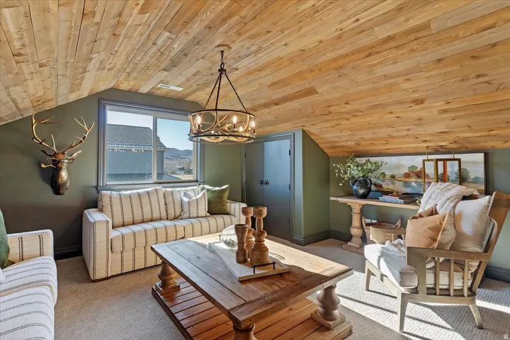 Vaulted wood-plank ceiling, large window, built-in double-door closet, and recessed lighting