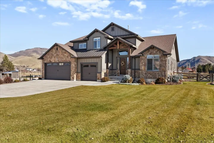 Stone and siding exterior with a multi-level roofline