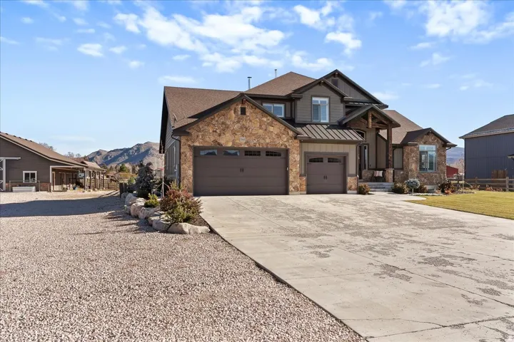 Stone veneer exterior with multiple gables and a covered entry