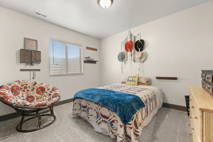 Wall-to-wall carpeting, window with blinds, recessed ceiling light fixture