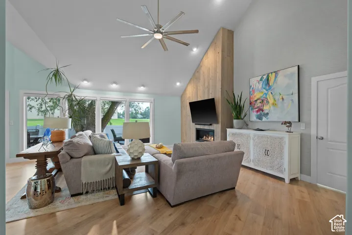 Vaulted ceiling with recessed lighting and a ceiling fan
