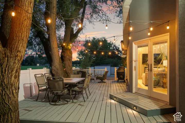 Exterior wood deck with integrated step lighting and double French doors