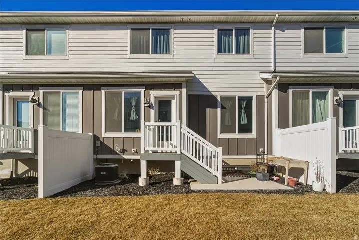 Two-story exterior with vinyl siding and white trim