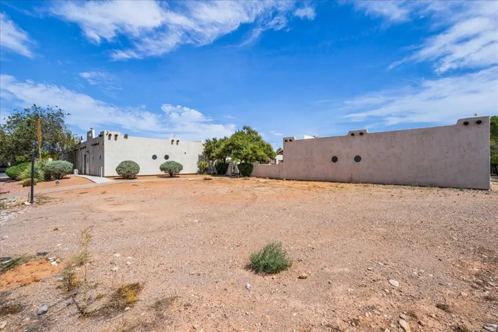 Adobe-style architecture with flat roof and parapet walls