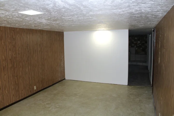 Paneling walls and recessed ceiling lighting