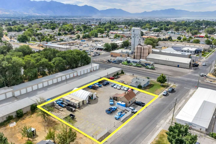Expansive lot with a detached structure, an additional covered structure, and street frontage