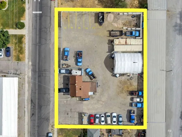 AddExpansive lot with a detached structure, an additional covered structure, and street frontageitional content