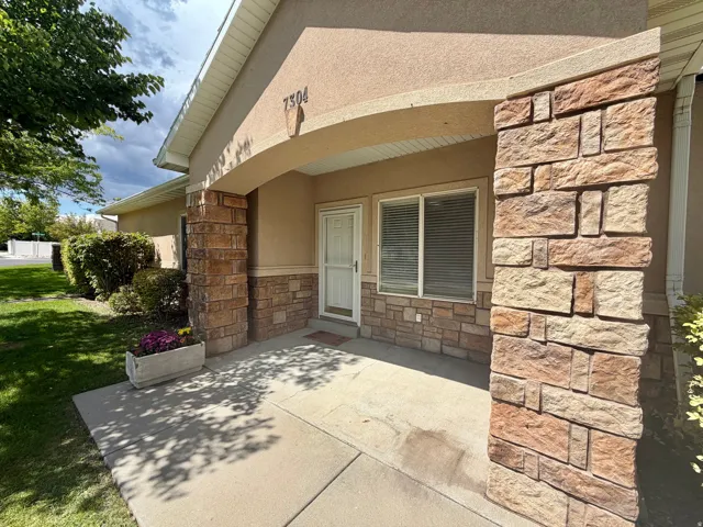 Stucco exterior with stone veneer accents