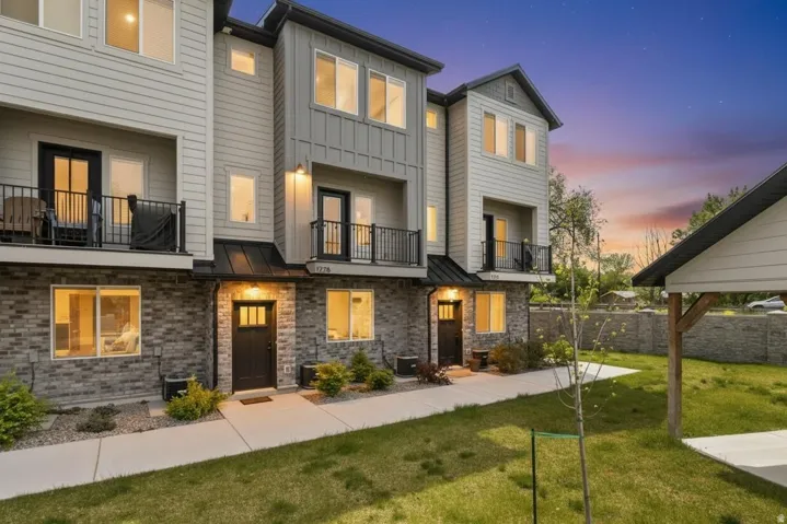 Contemporary multi-level exterior with brick and horizontal siding