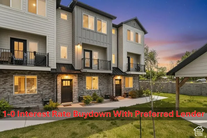 Multi-level exterior featuring light-toned horizontal siding, vertical board-and-batten accents, and a brick-veneer base