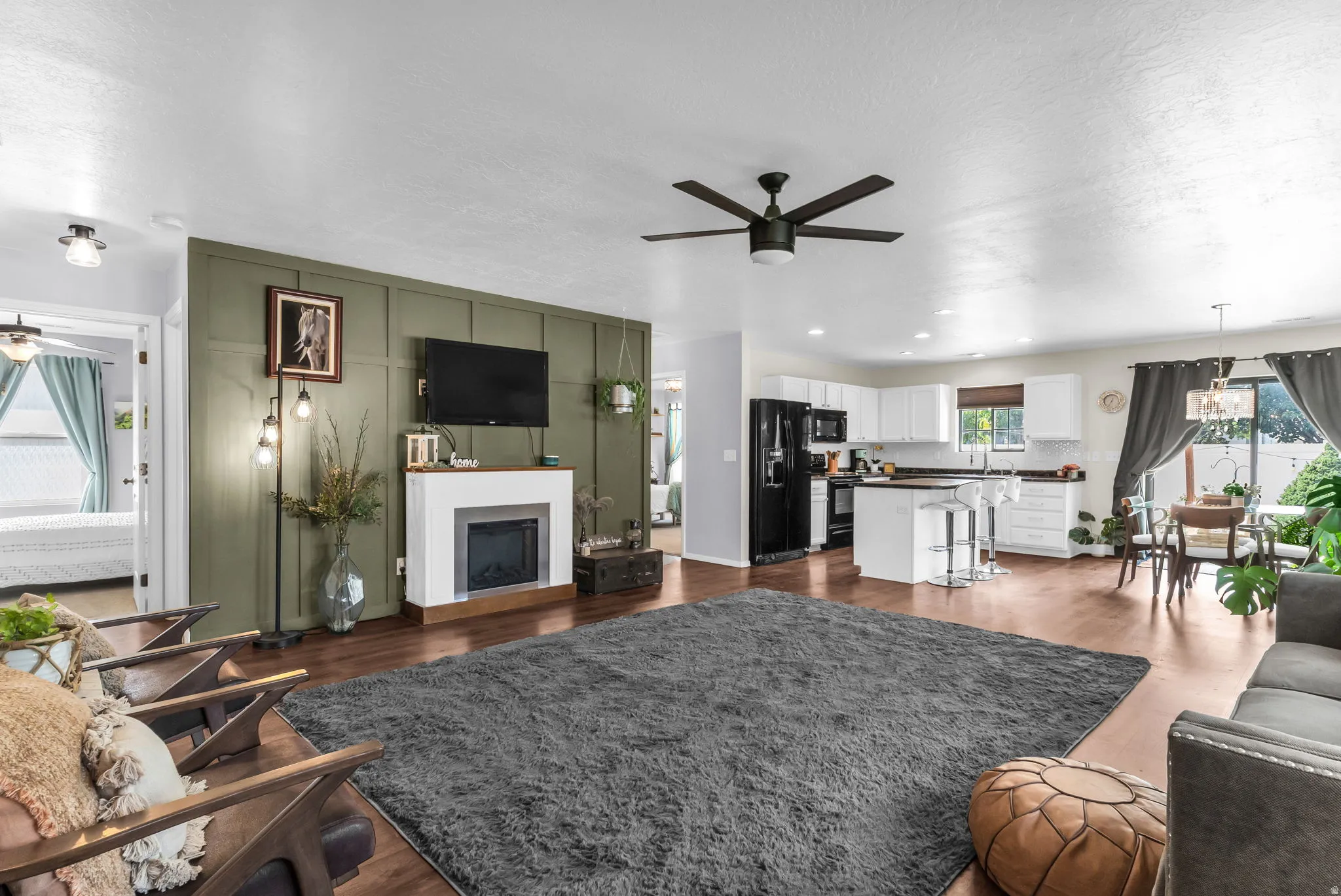 Large open greatroom with custom designed accent wall.
