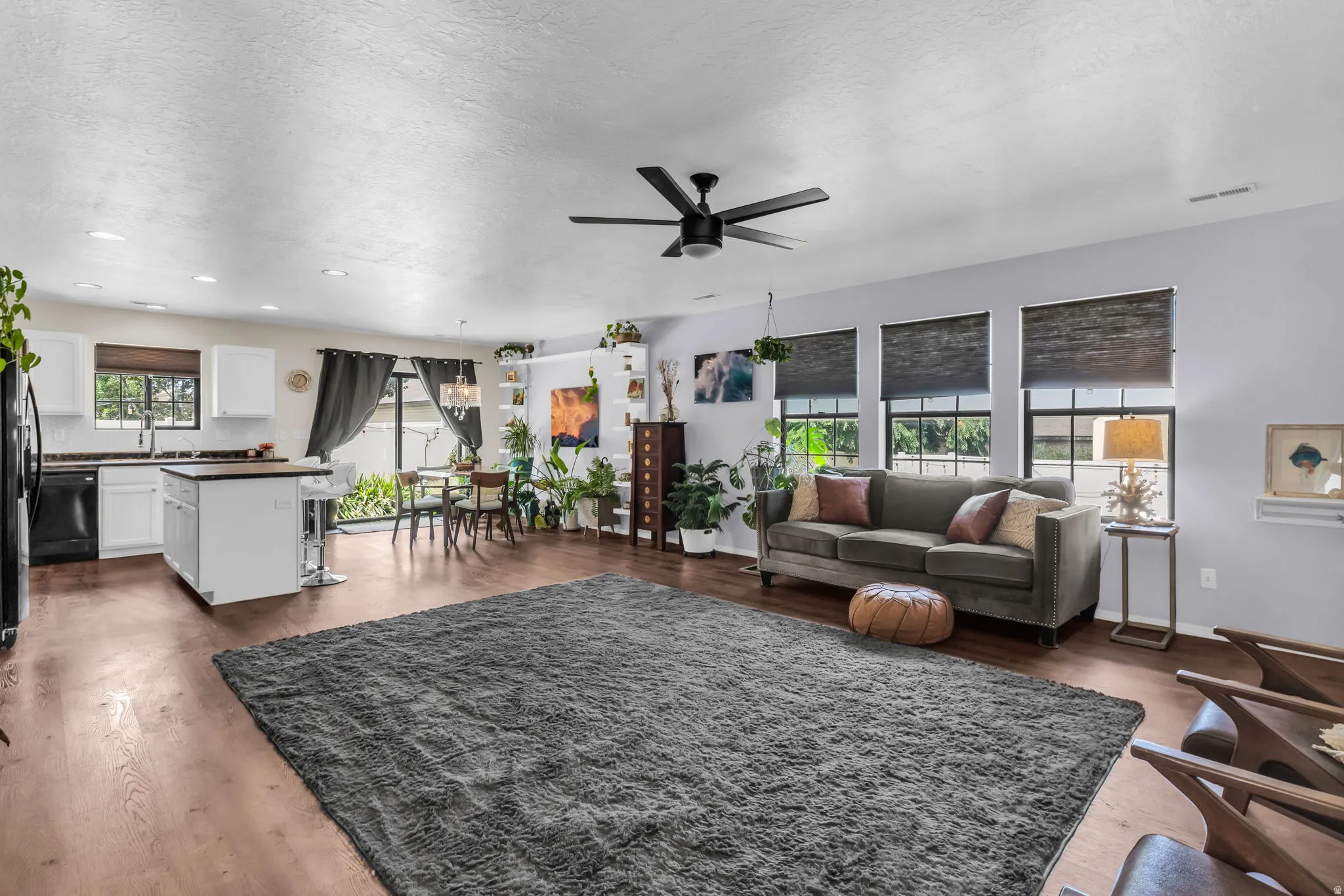 Gorgeous LVP wood laminate flooring & upscale window shades.