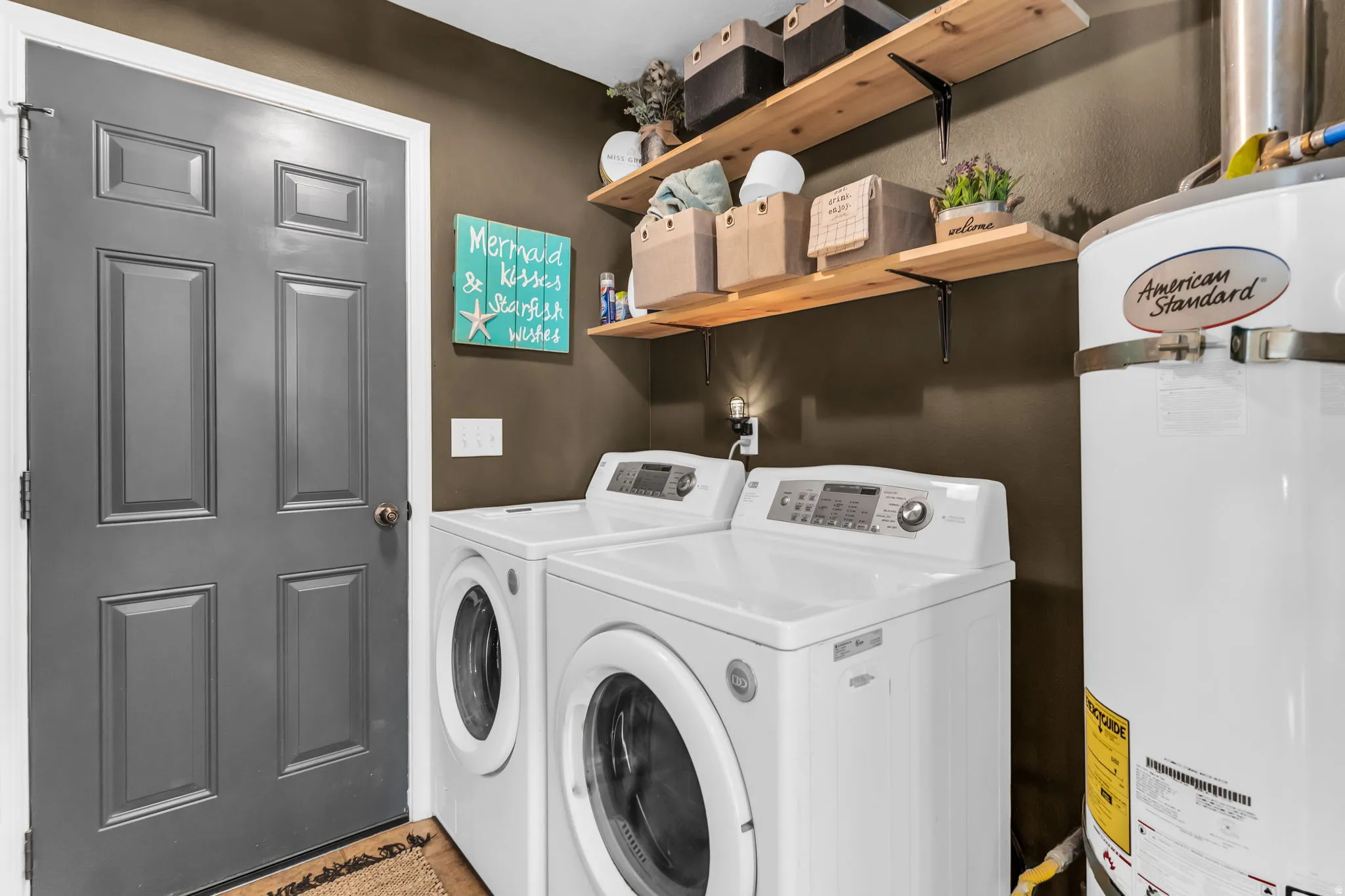 Laundry with shelving on main level